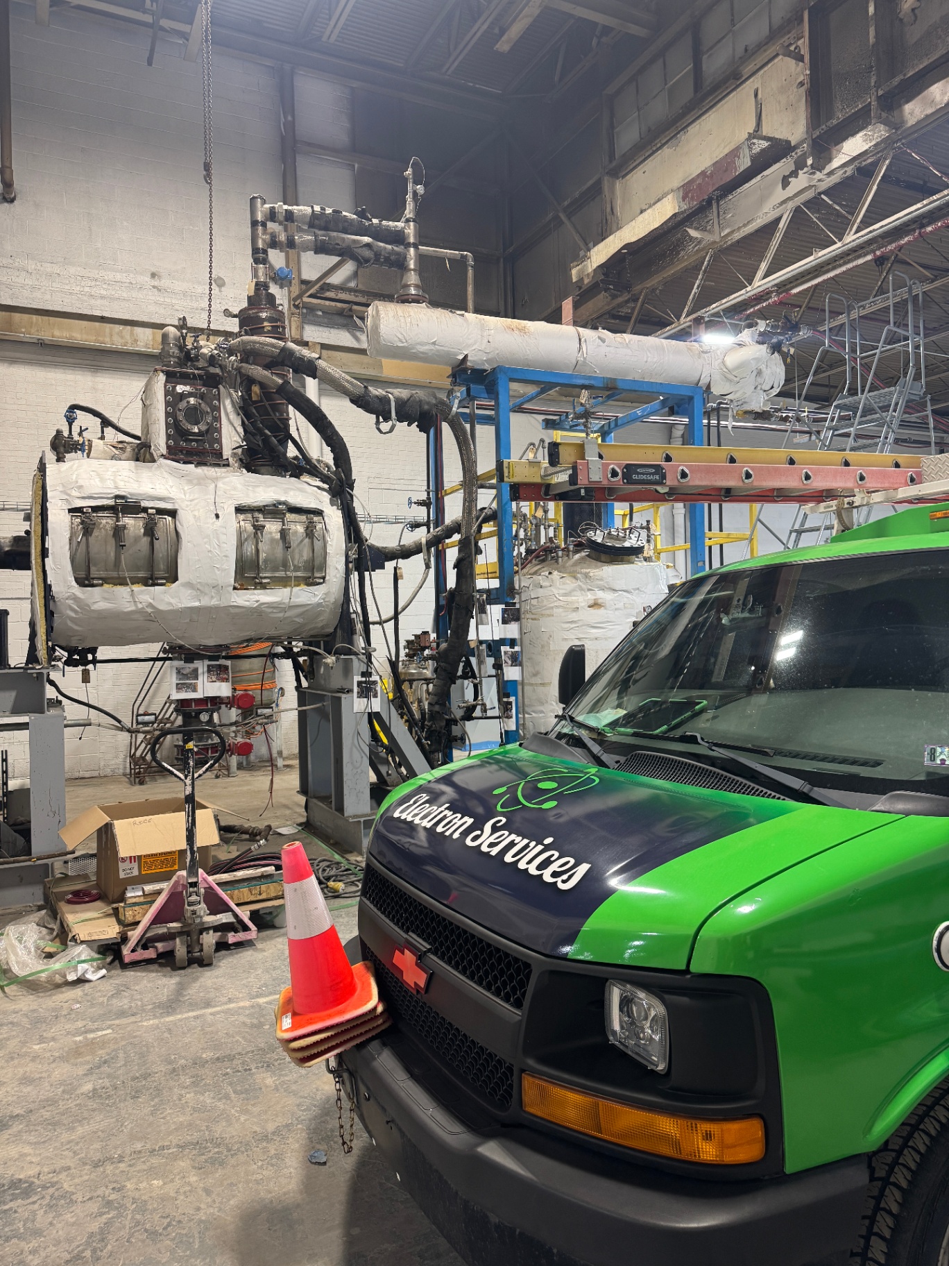 Industrial electrician working on MCC panel